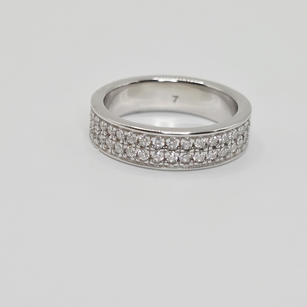 This is a 2 Row Moissanite Diamonds Band . S925 Silver. vvs1 D. size 7